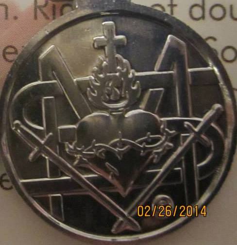 Reverse side of medal depicting the Sacred Heart of Jesus, but the swords do not pierce the Sacred Heart however Blessed Mother is instead crowned with thorns!